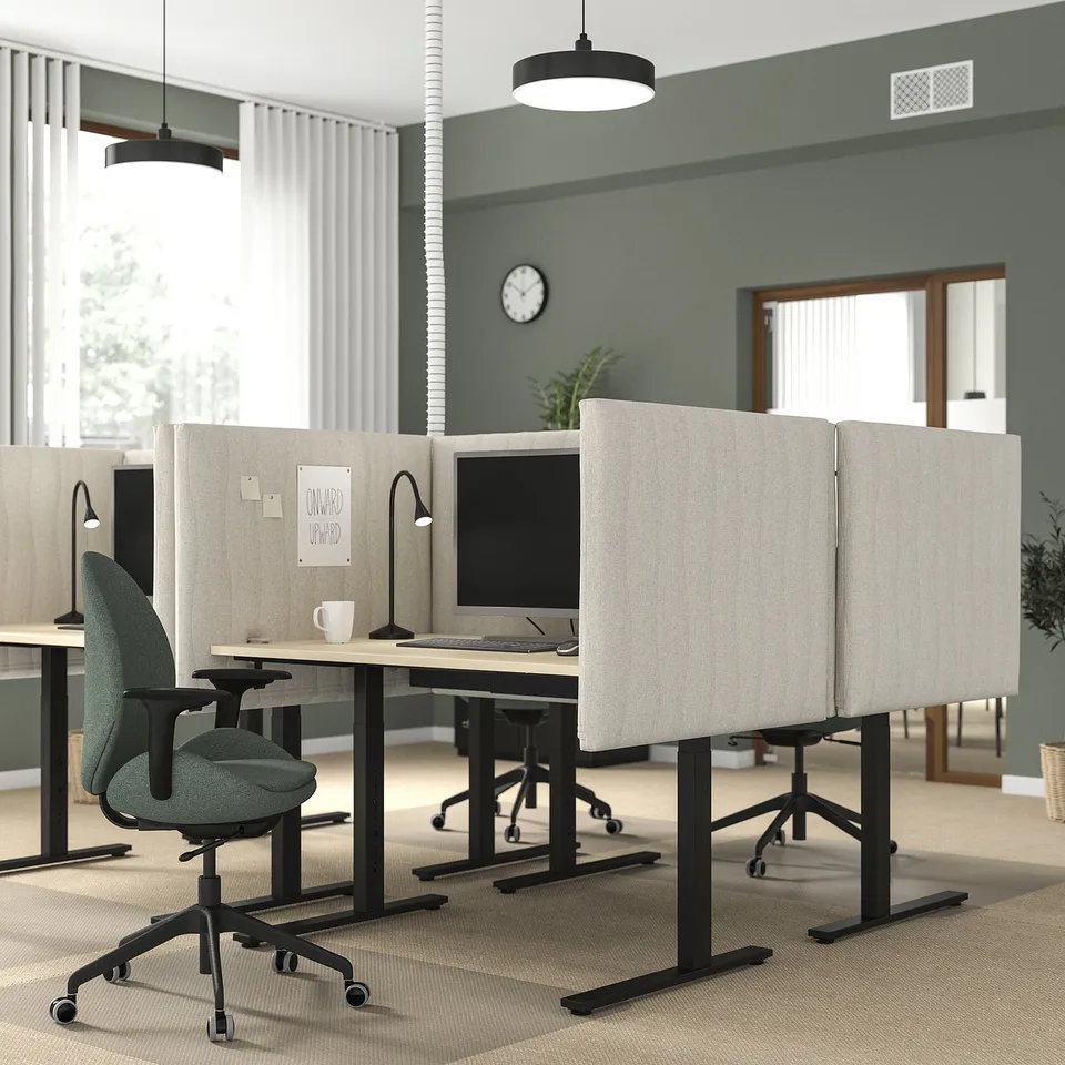 Contemporary office with MITTZON adjustable desks in neutral tones, acoustic screens, ergonomic chairs, minimalist design, and spacious work areas.