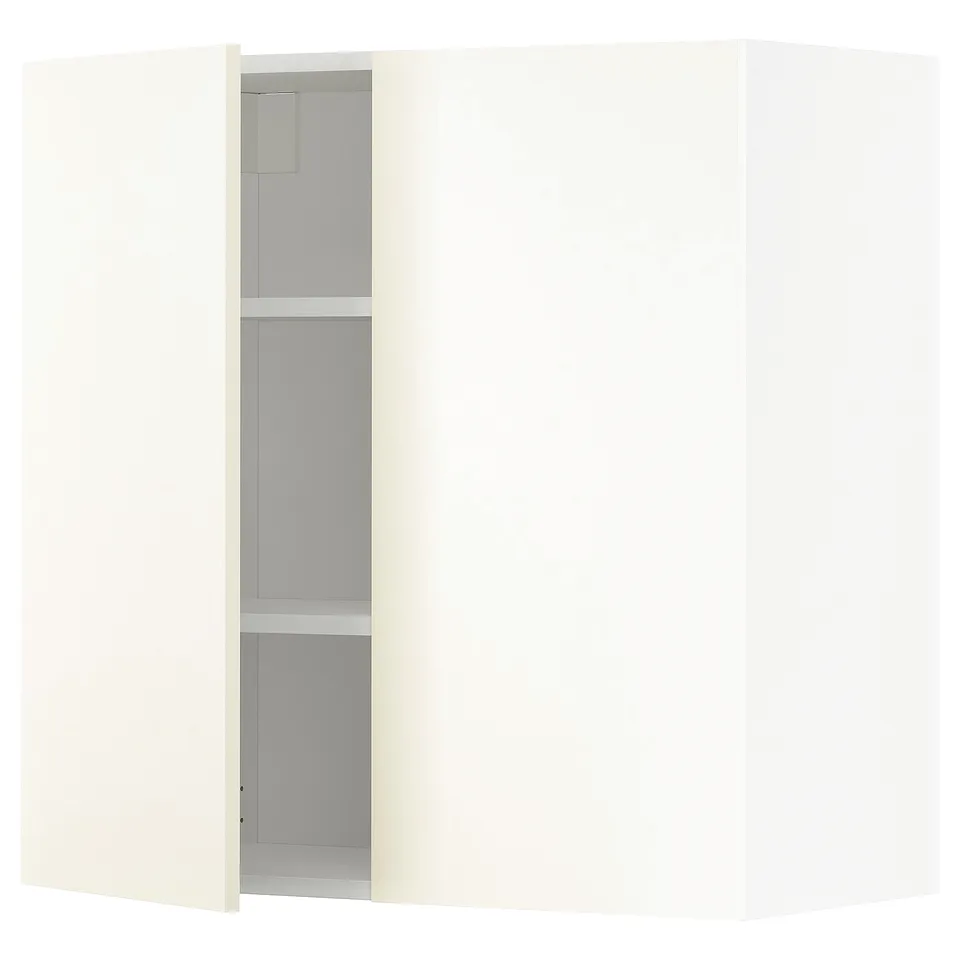 A white METOD kitchen wall cabinet with an open door, revealing adjustable shelves. Its square-shaped with a modern design.