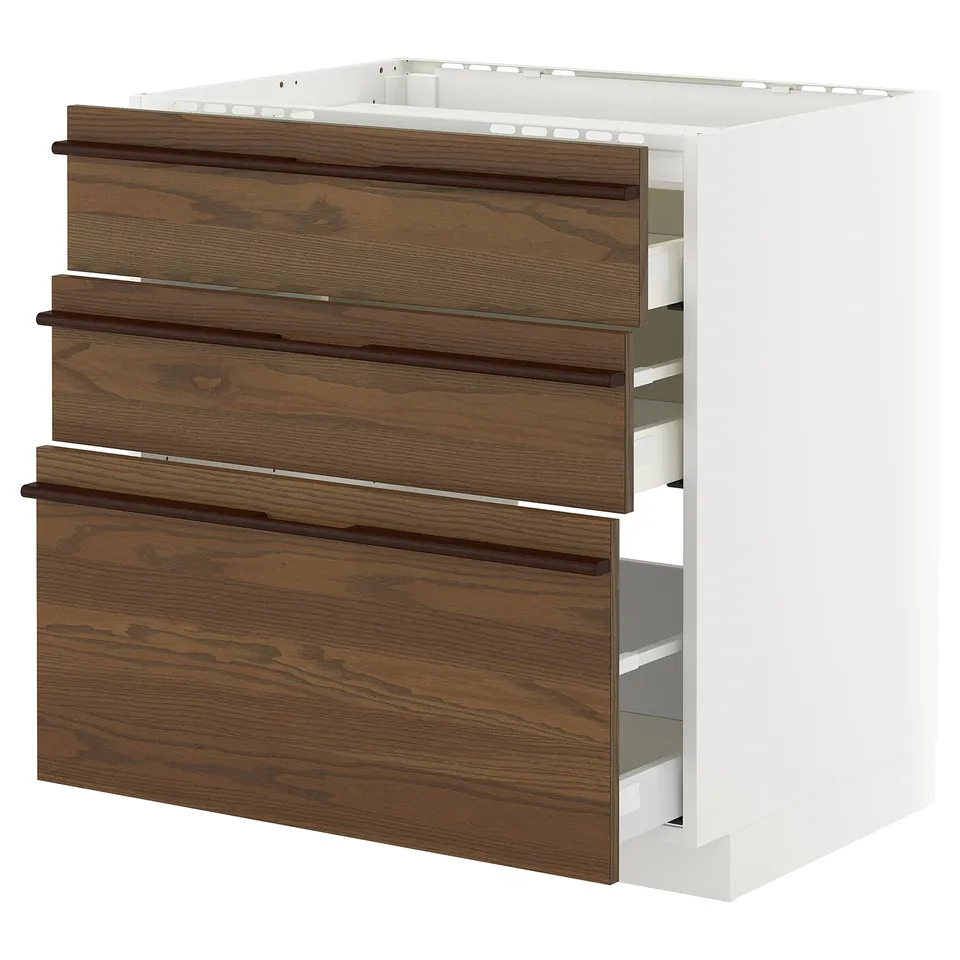 White and brown ikea METOD kitchen unit with wooden handles and three drawers.