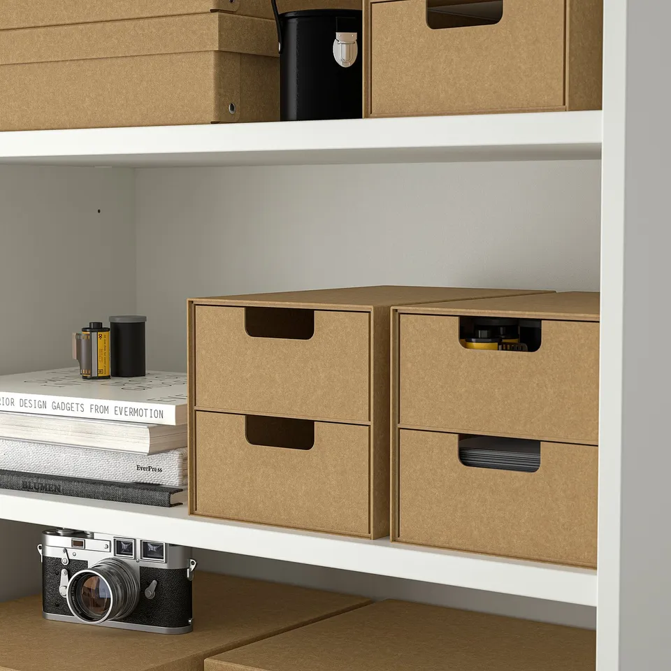 Brown cardboard boxes on white shelves, GÄRDESGÅRD series.