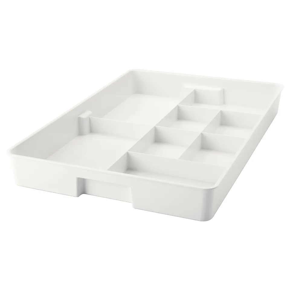 A white KUGGIS organiser tray, designed with multiple compartments for storage, made of recycled pet plastic.