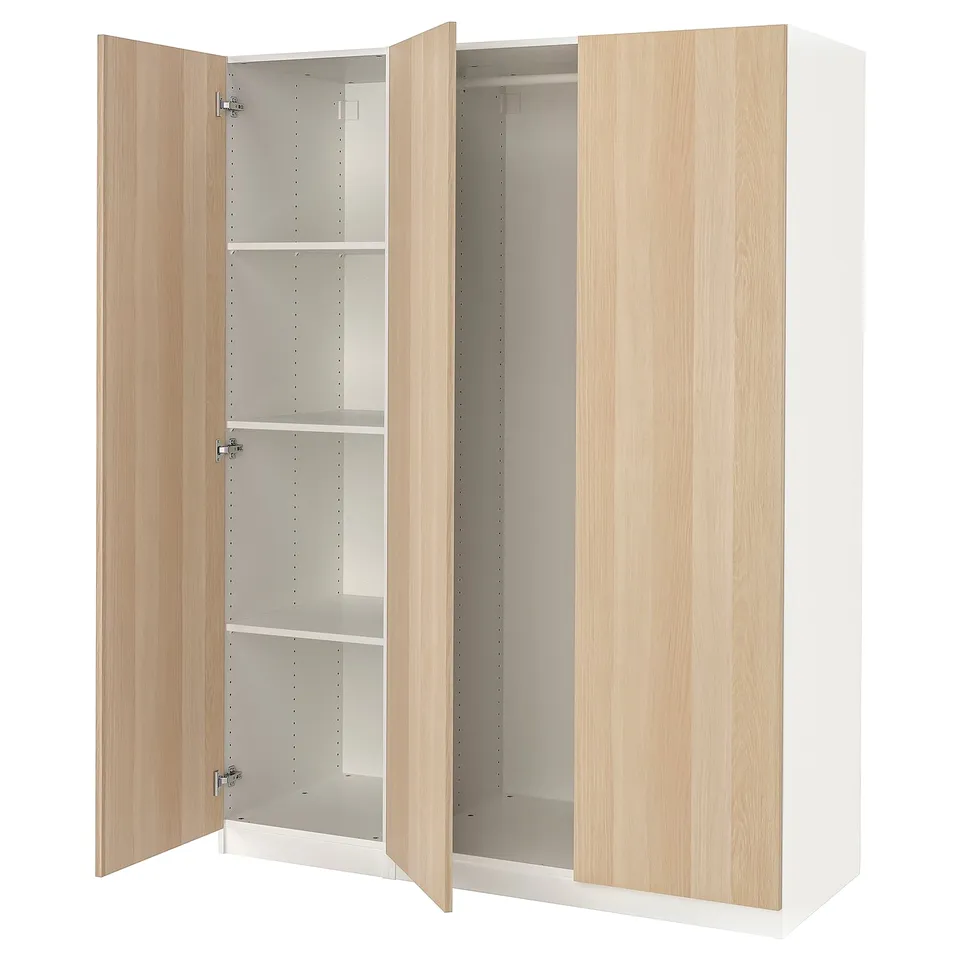 Open light wood PAX wardrobe with adjustable shelves.