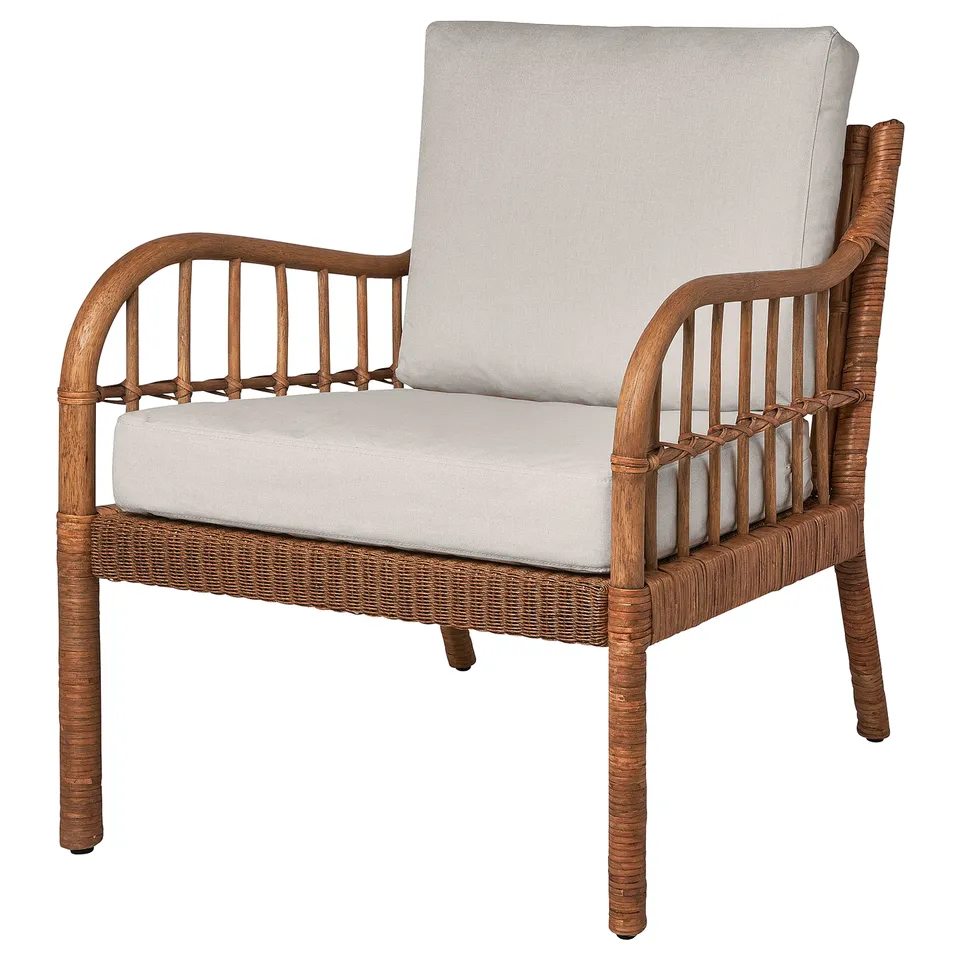 HOLMSTA armchair: wicker, wood, bamboo; light grey cushion; curved shape, rattan weave detail.