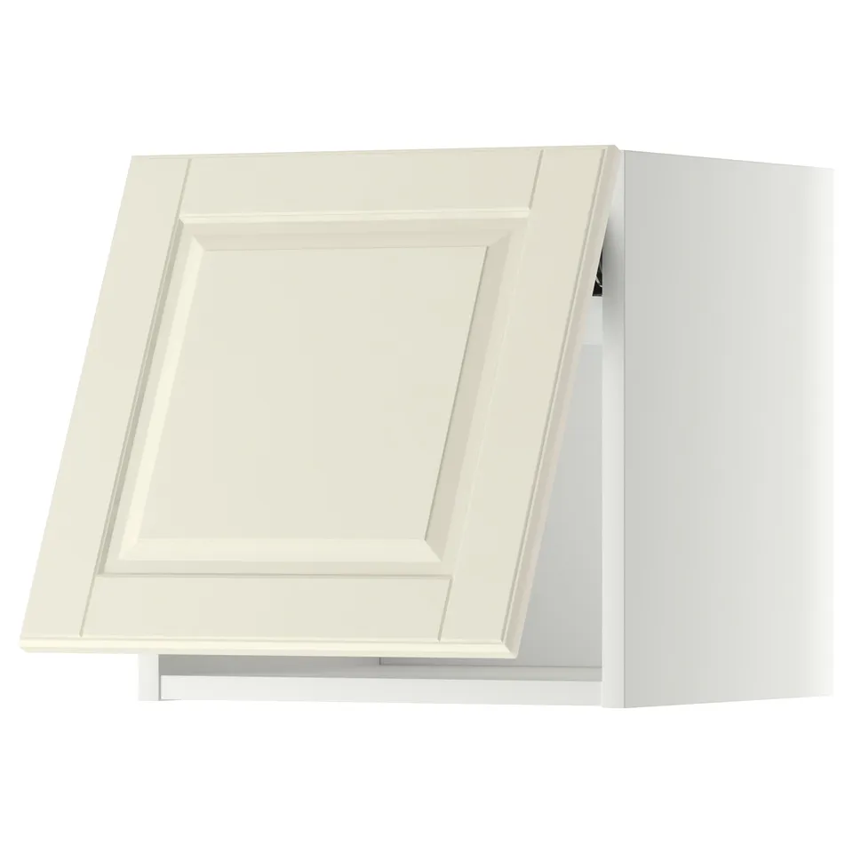 A white, wooden kitchen cabinet with a raised panel design and bevelled edges.