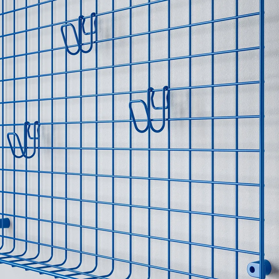 Blue wire grid wall organiser with multiple hooks, ideal for hanging items.