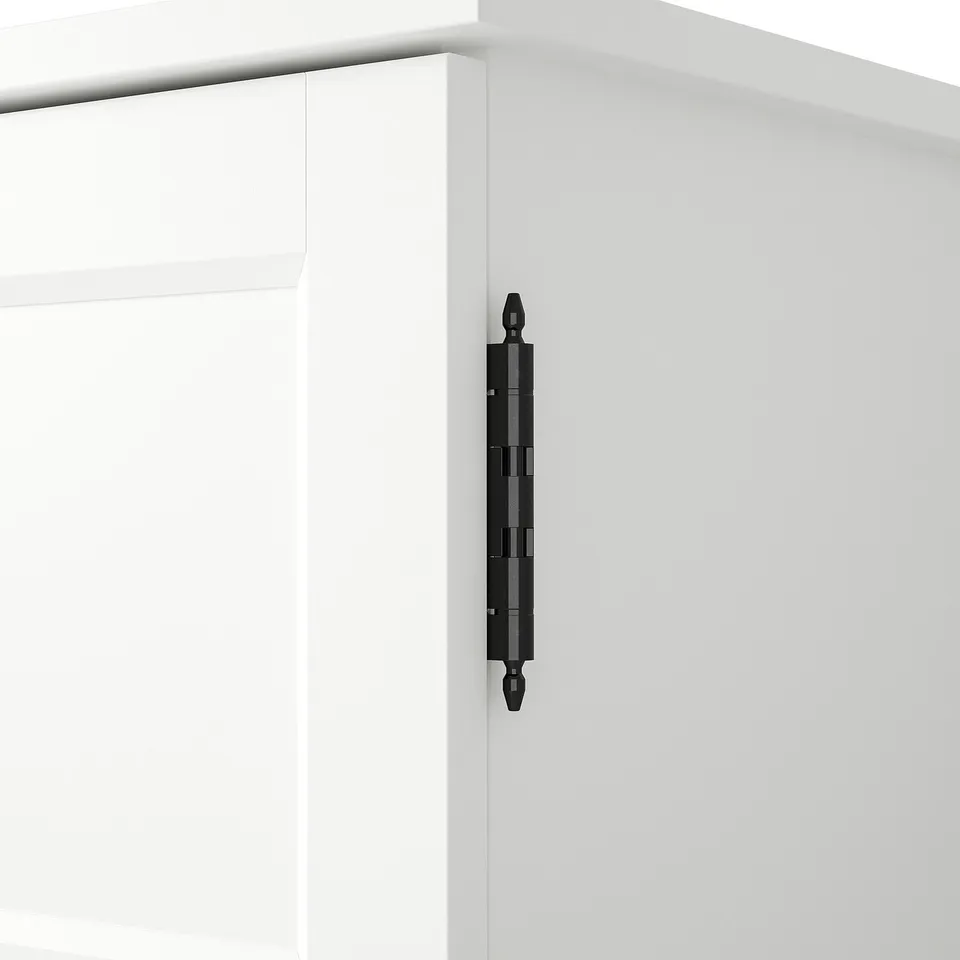 Black handle attached to white cabinet drawer, showcasing sleek design and quality finish.