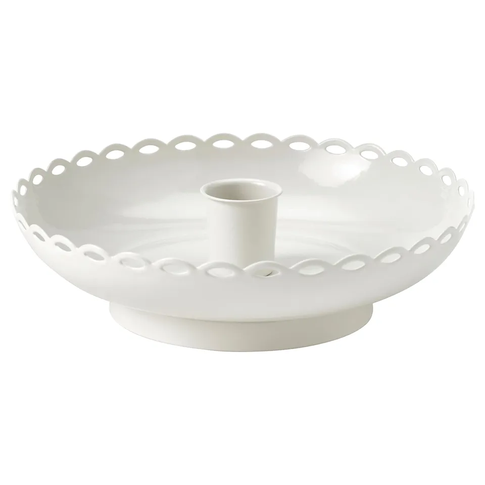 Round white ceramic candlestick with scalloped edge and central tube for candle.