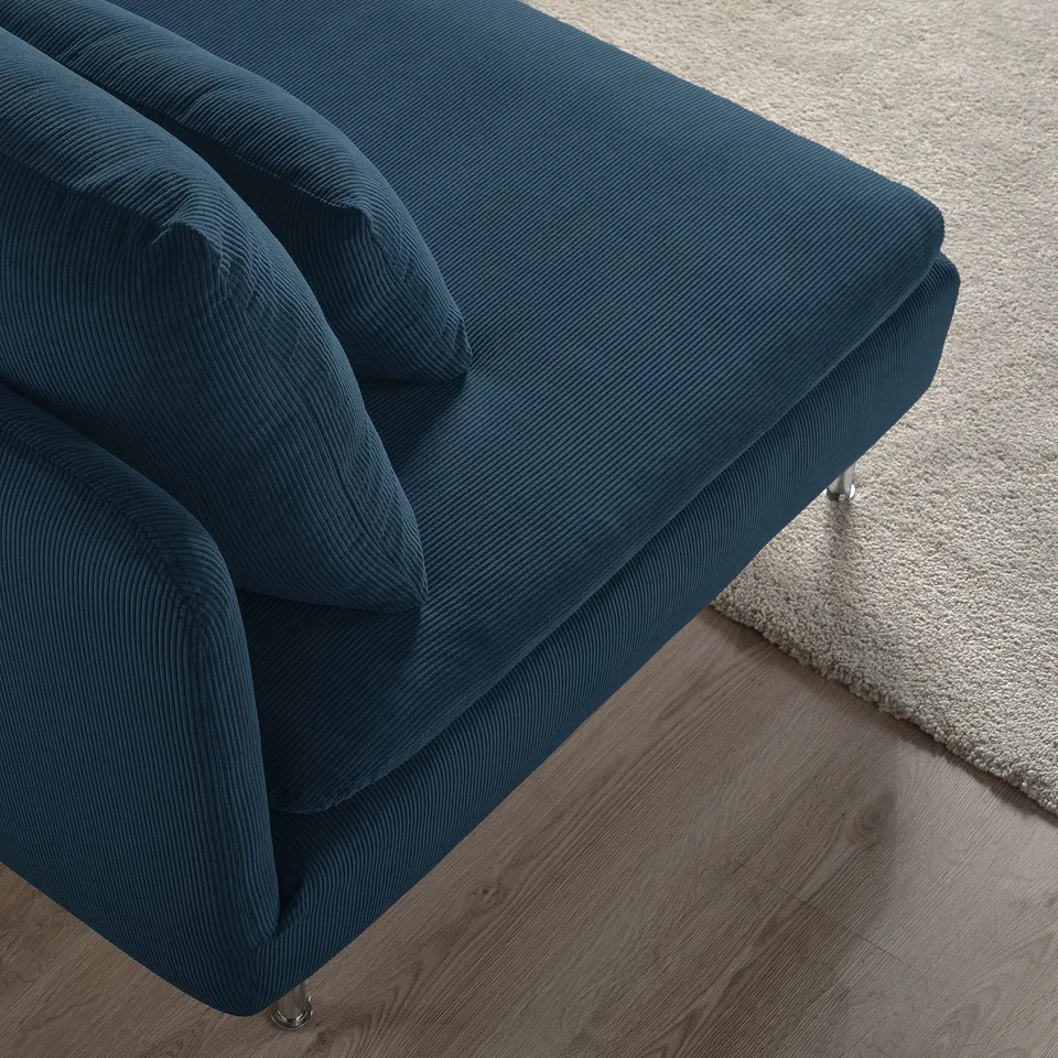 Deep-seated modern sofa, teal corduroy, plush cushions. Comfortable, high-legged design.