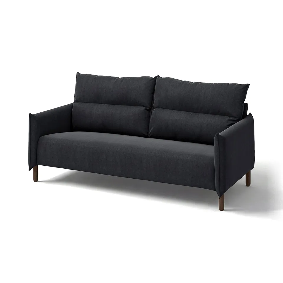 Black MANNARP sofa, sleek modern design, cushy fabric, high backrest, wooden legs.