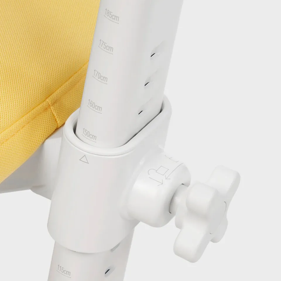 Adjustable white height mechanism on a yellow desk, marked with measurements from 115cm to 185cm.