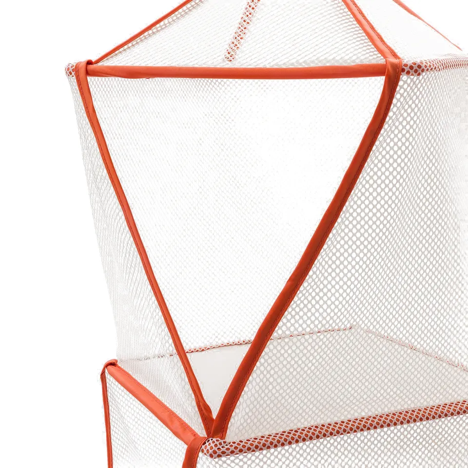 Close-up of durable, geometric mesh tent with bright, reinforced edges.