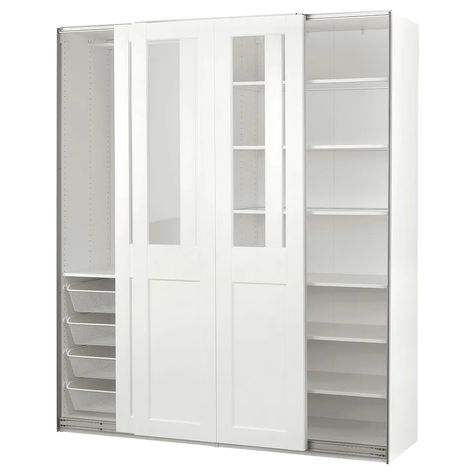A white PAX wardrobe with glass doors and metal mesh baskets. It sliding doors and shelves for storage.