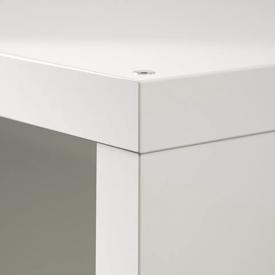 Clean white cabinet corner; smooth finish, precision edges; modern design.