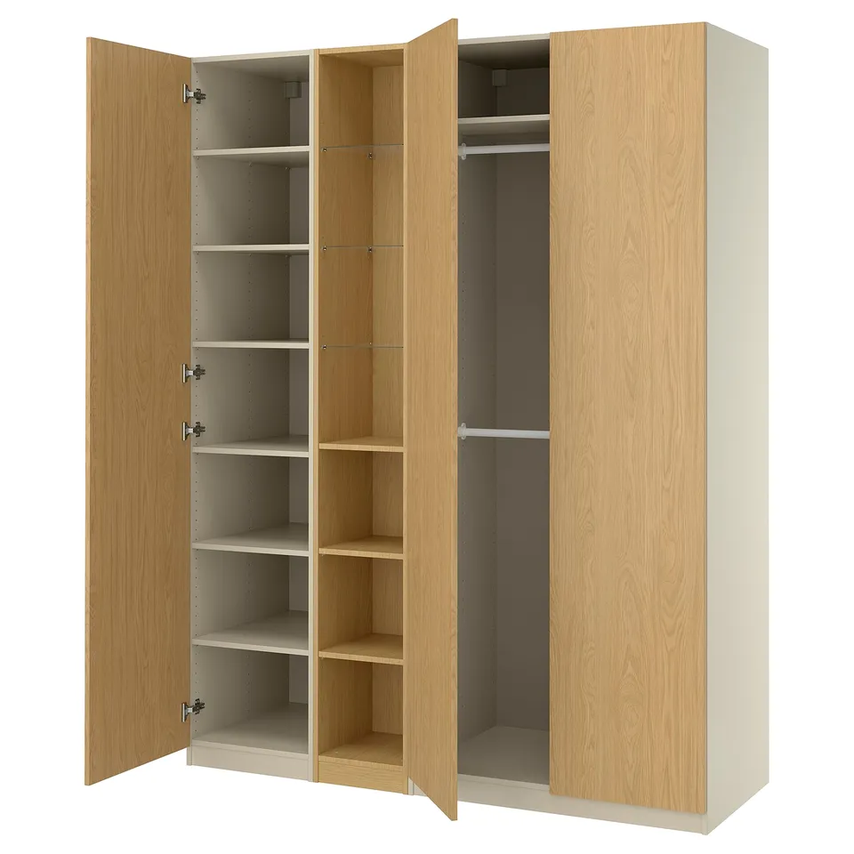 Open IKEA PAX wardrobe in light oak, showing shelves and hanging rod.