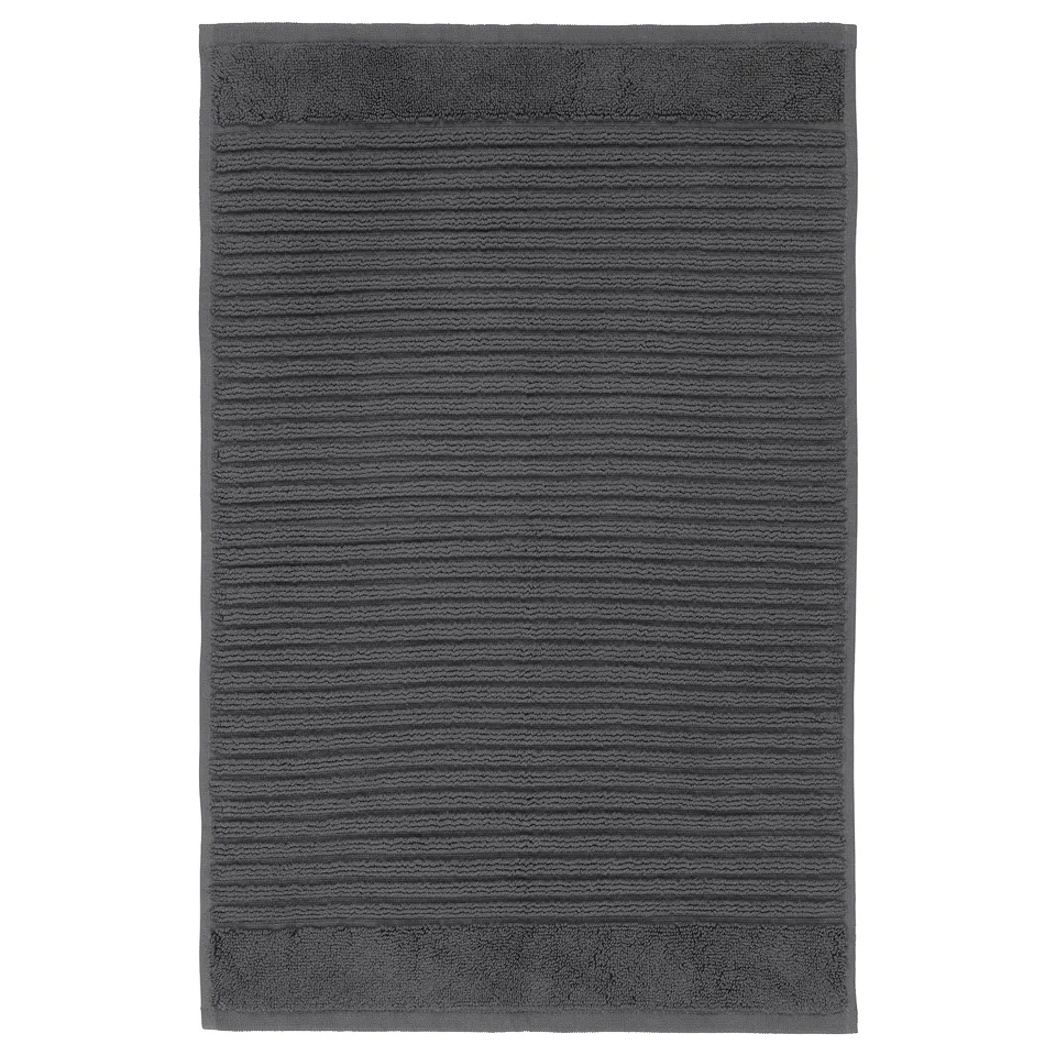 Dark grey ALSTERN cotton bath mat, rectangular with textured striped design.