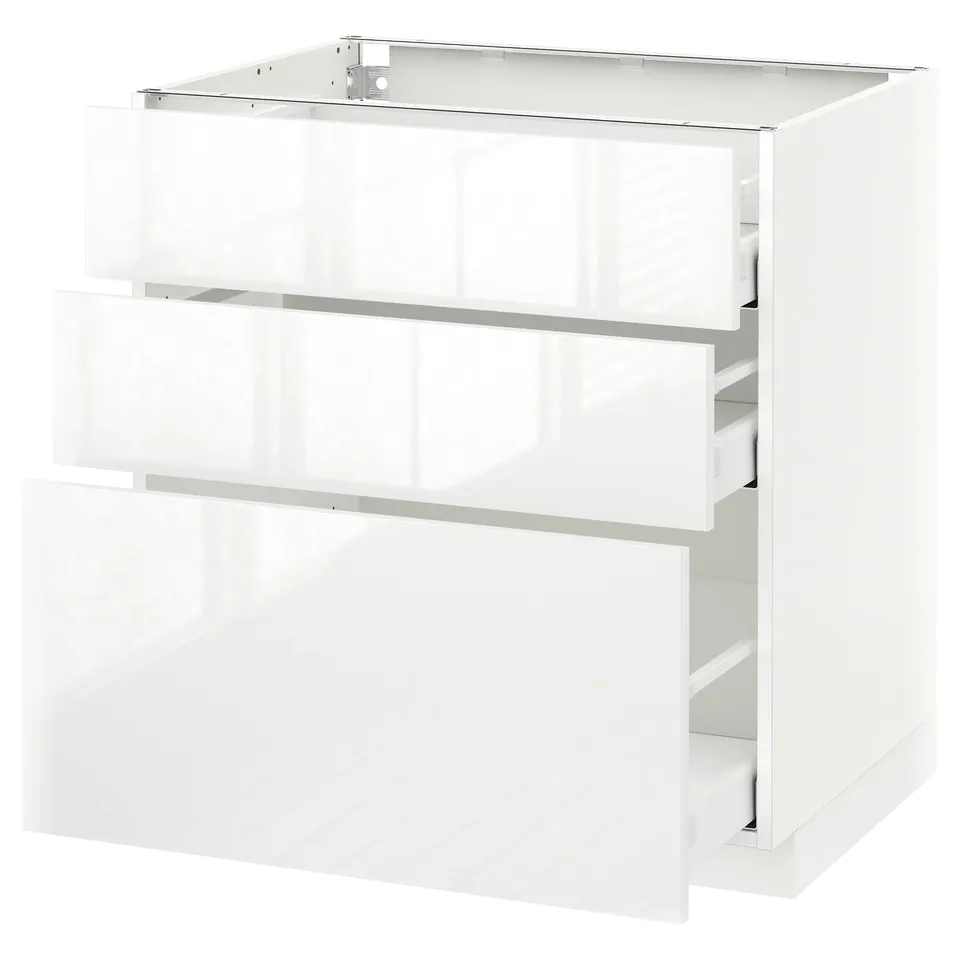 A white, modern METOD kitchen cabinet with three high gloss drawer fronts and a sleek design.