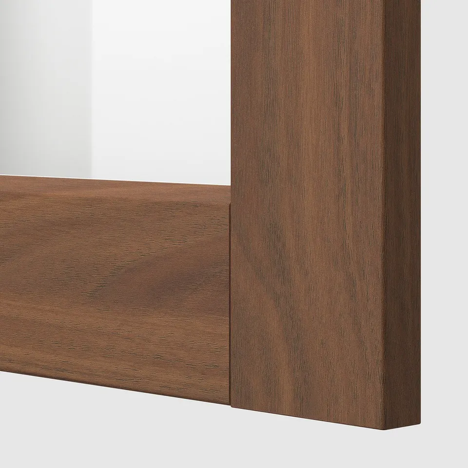 Close-up of a dark wooden frame, showcasing its smooth finish and grain texture.