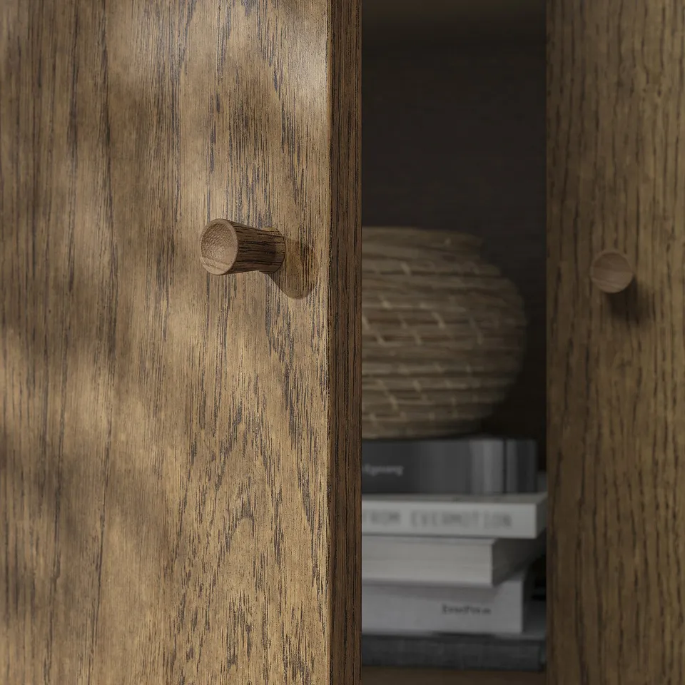 Wooden cabinet with detailed handle; shows quality, natural finish.