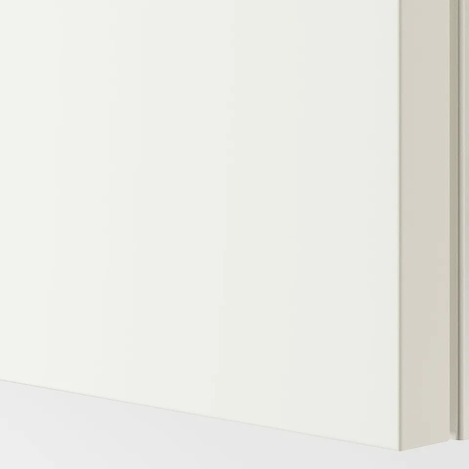 Close-up of HASVIK white, matte sliding door. Shows smooth finish and sleek edge design.