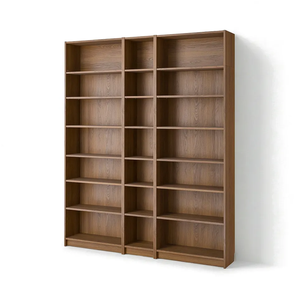 Wooden BILLY bookcase with multiple empty shelves on a white wall.