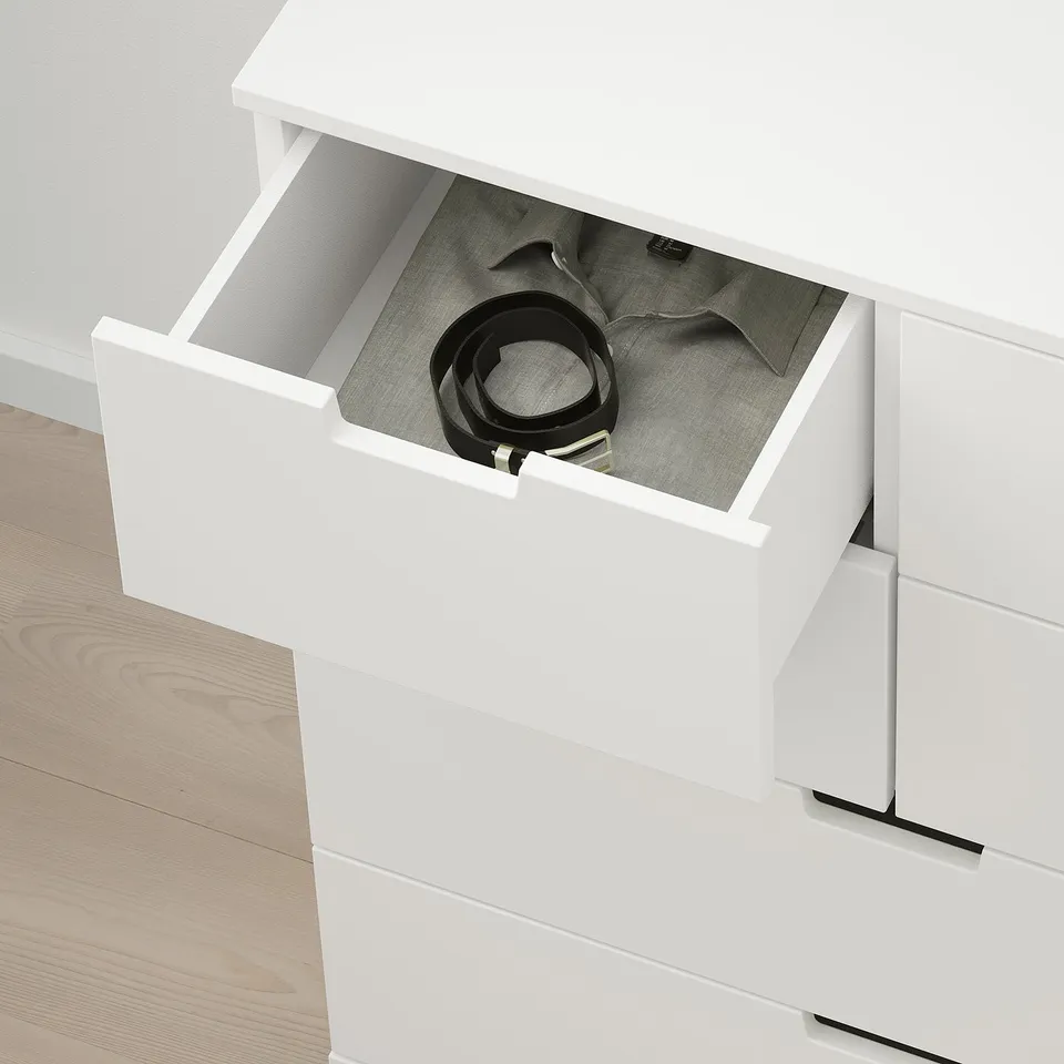Open NORDLI dresser with belt, clothes, smooth runners.