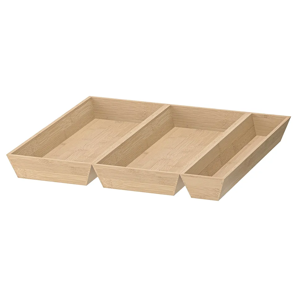 A wooden bamboo drawer organiser named UPPDATERA. It multiple compartments for kitchen storage.