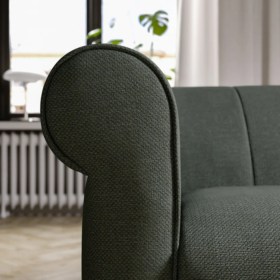 Dark green VISKAFORS armchair, curved back & arms, soft fabric, cosy seat.