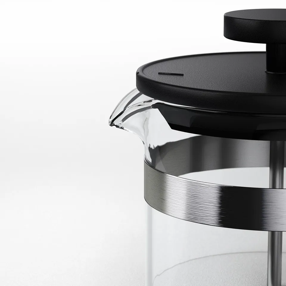 Clear glass coffee maker with black lid and stainless steel base, sleek and modern design.