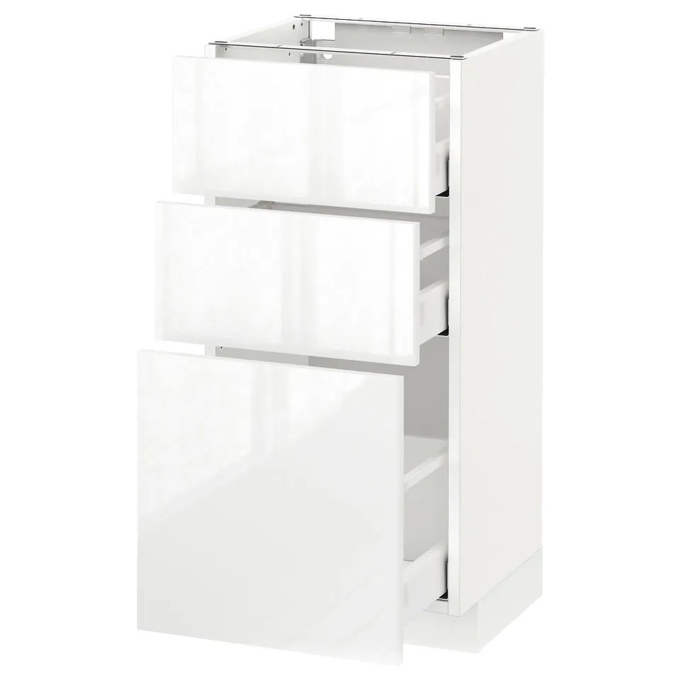 White METOD kitchen cabinet with high gloss, three drawers, modern design.