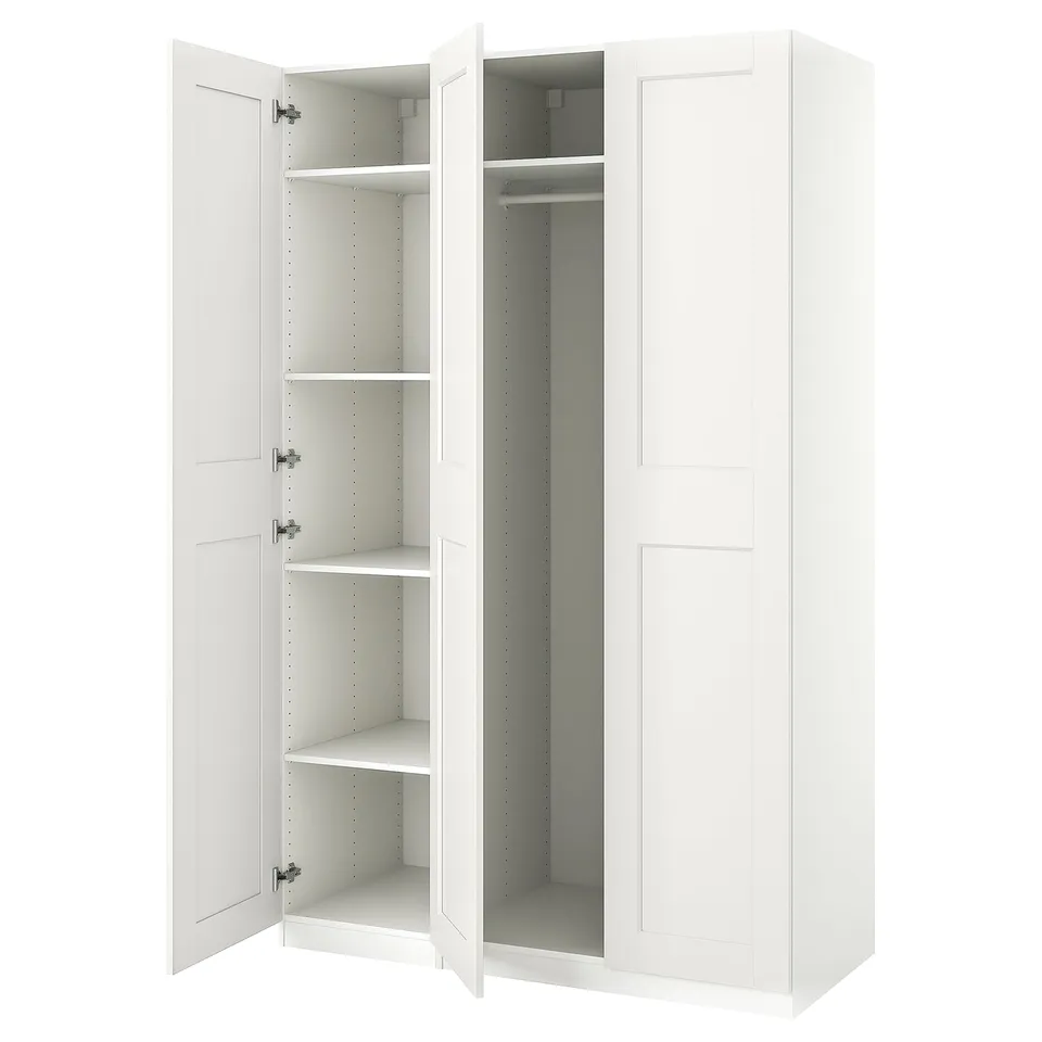 White ikea PAX wardrobe, open showing empty shelves and hanging rod, modern minimalist design.