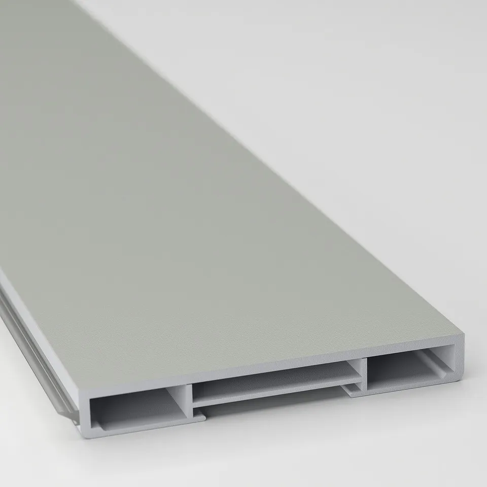 A close-up of a light grey kitchen cabinet plinth, showcasing its smooth paper foil surface and clean edges designed for a modern look.