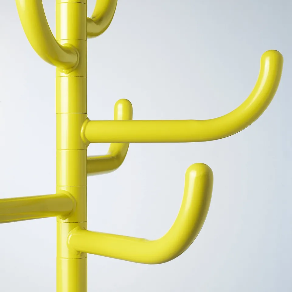 Bright yellow coat stand, robust metal tubes, multiple hooks, modern design.
