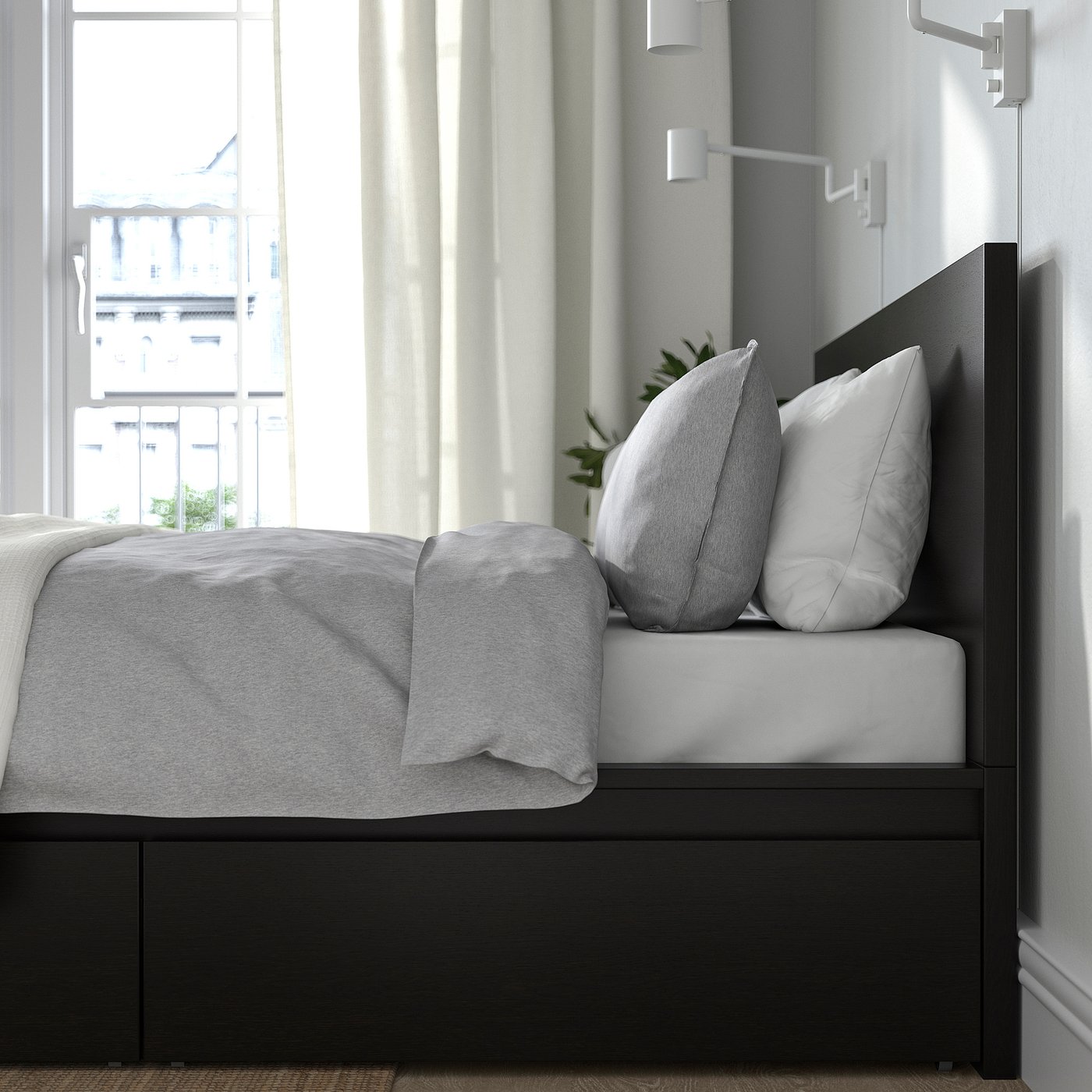 Minimalist bed with high headboard and storage drawers, offering comfort and space.