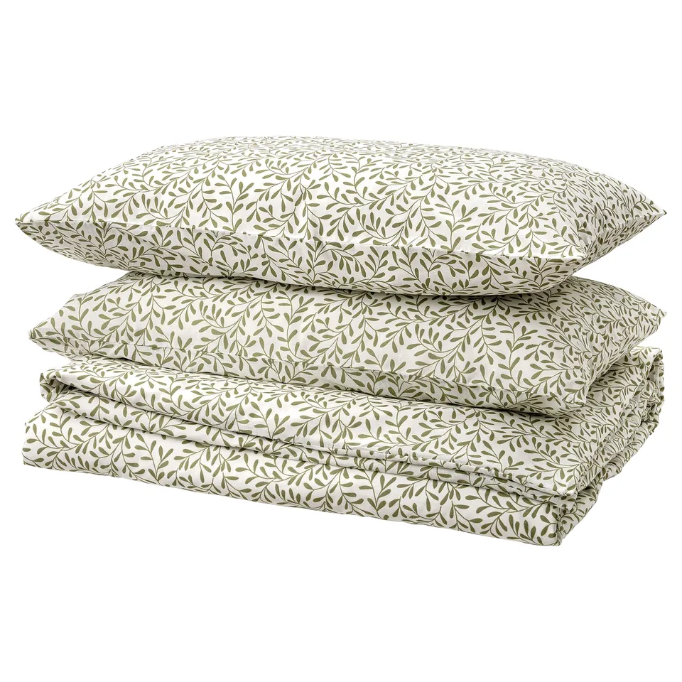 Botanical-themed bedding set, white with green leaf pattern, recycled polyester, and cotton blend, rectangular shape.