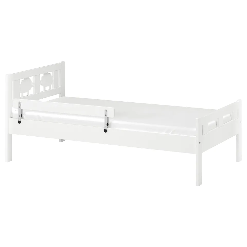 A white KRITTER kids bed with a headboard, slatted base, and safety rail.