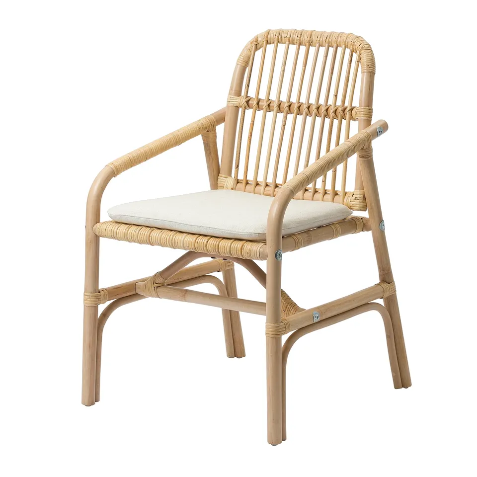 Wicker chair with beige cushion. Rattan back and arms, seat cushion adds comfort. Solid and stylish for seating.