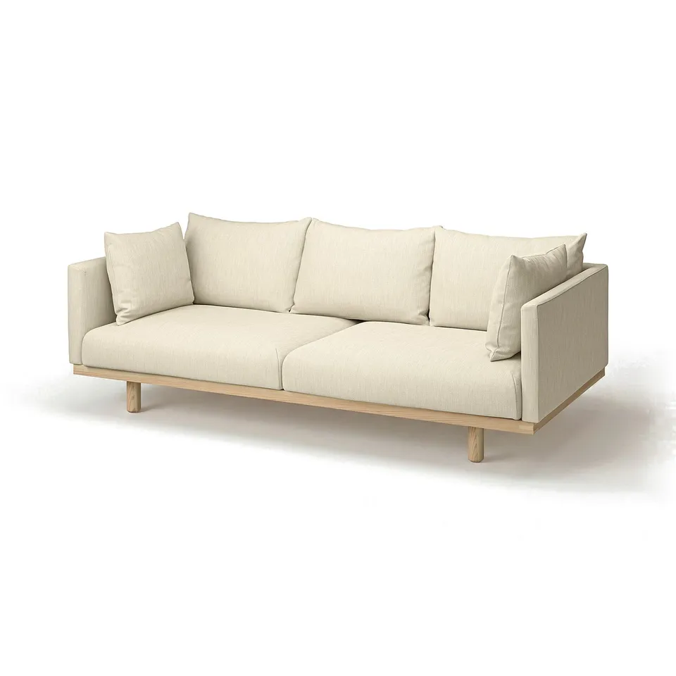Light beige stockholm sofa with wooden legs, soft cushions, and minimalist design.