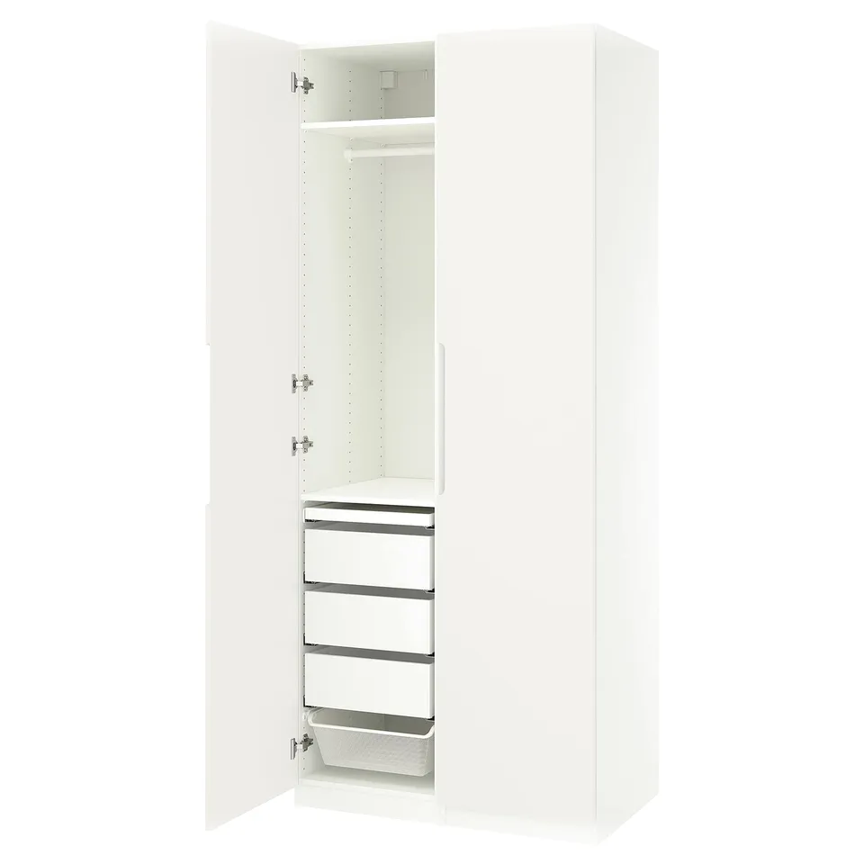 A white ikea PAX wardrobe with doors open, revealing shelves and drawers.