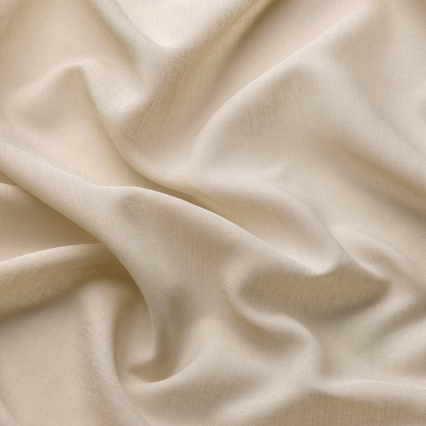 Soft, sheer beige curtains with delicate folds, offering gentle light filtering and privacy. High-quality fabric, sustainably produced.