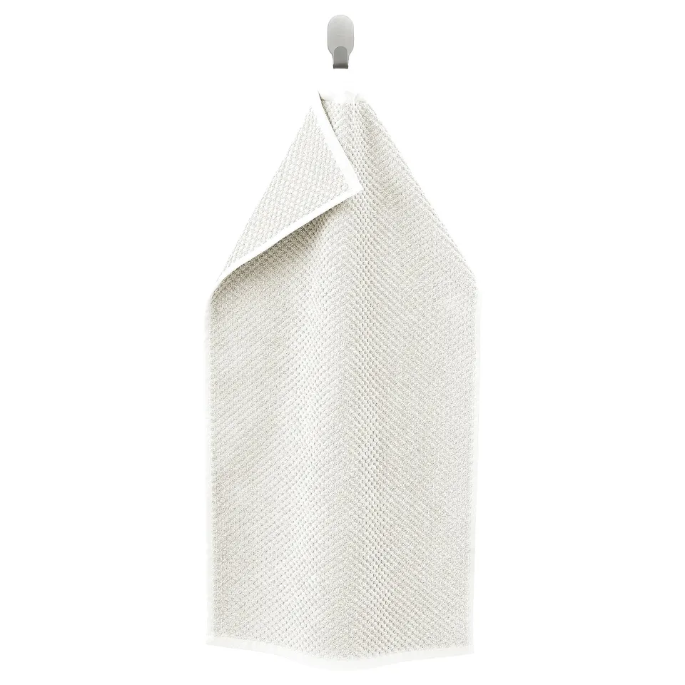 A beige GULVIAL towel hanging, soft and fluffy, made of 100% cotton, rectangular with folded edges.