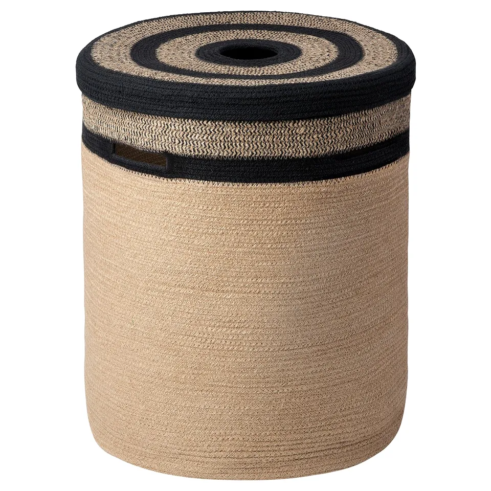 Tan jute & black cotton ikea MÄVINN storage basket, ideal for laundry or decor.
