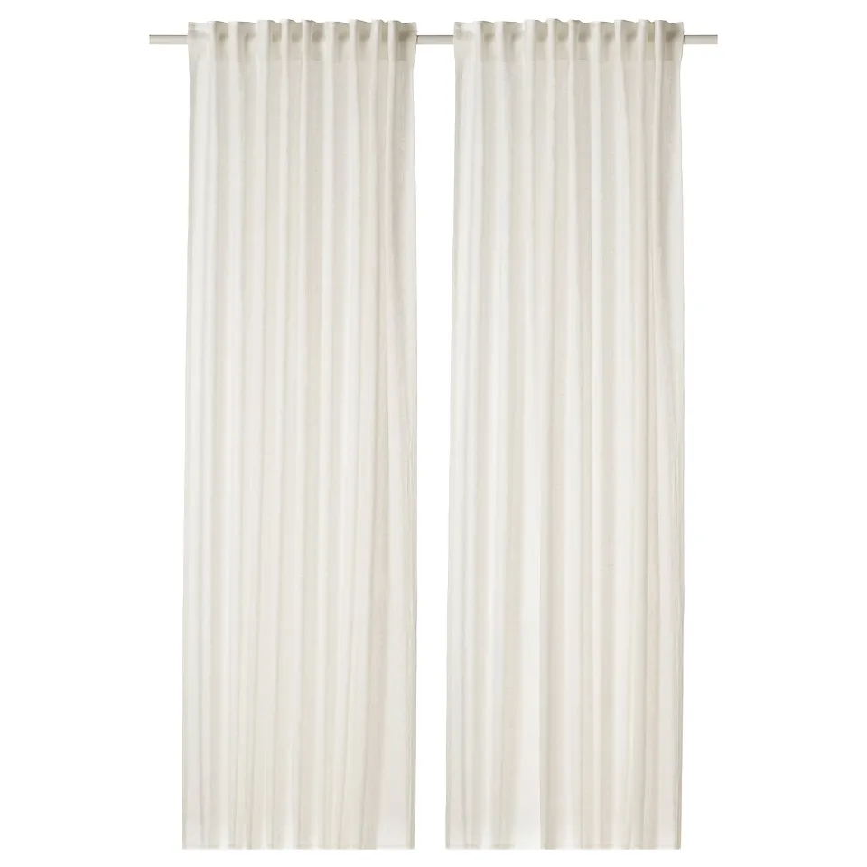 Two white linen curtains with a textured appearance hang side by side, featuring a simple, minimalist design suited for any room.
