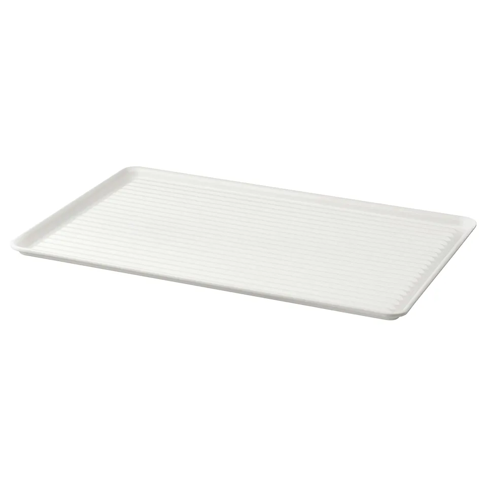 White VÄLVÅRDAD dish drainer with raised edges, made of galvanised steel. Efficient for drying dishes.