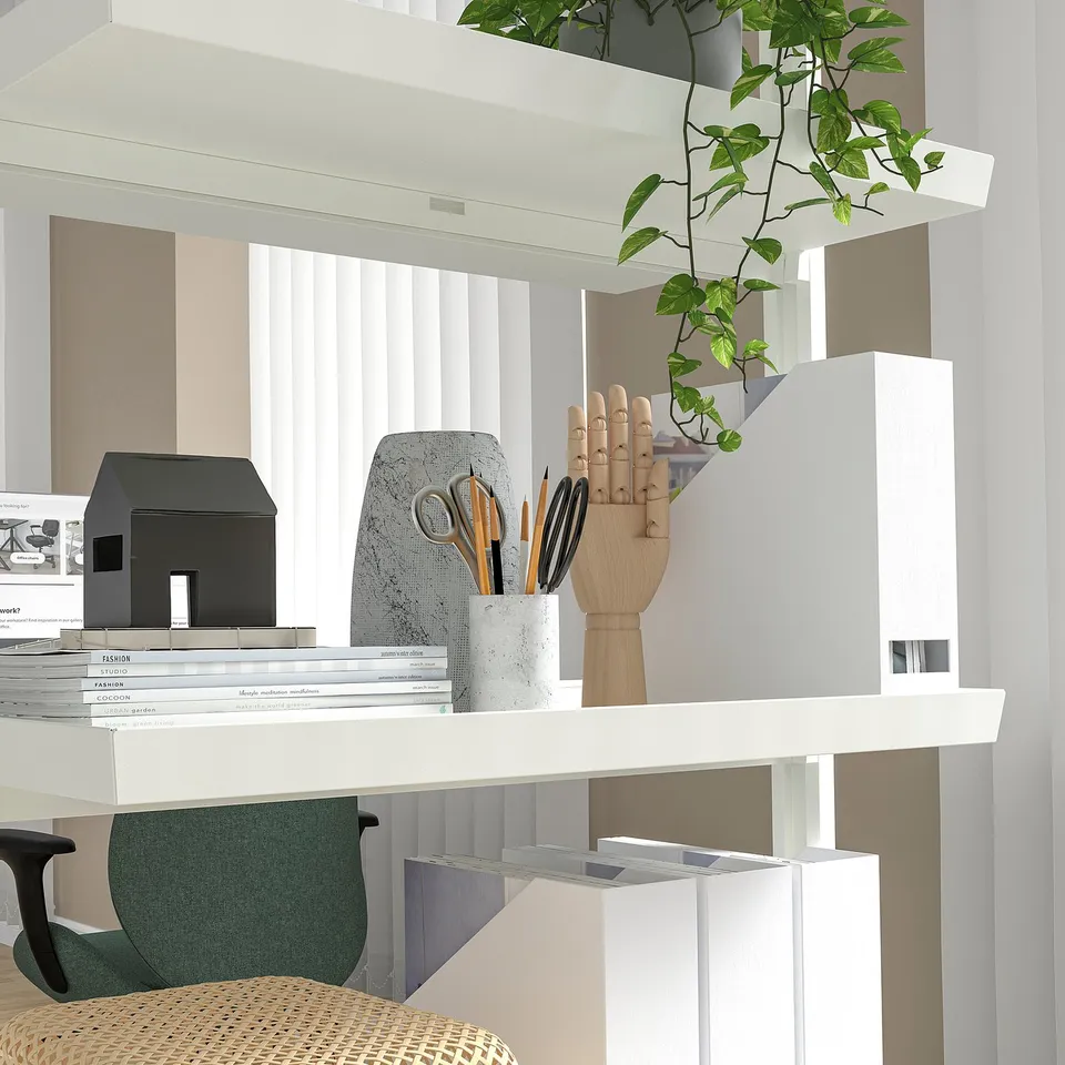 Modern office desk with book shelves, pens, plants, and printer, featuring lockable castors.