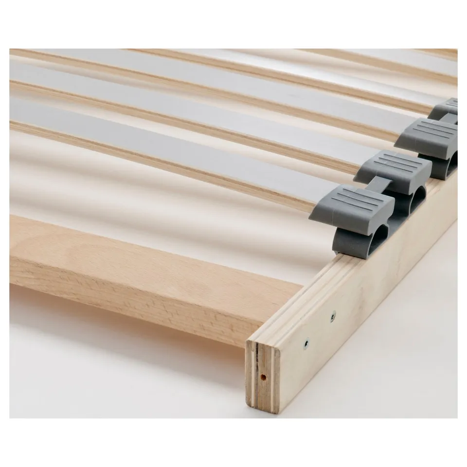 Close-up of a wooden bed frame with built-in slats, showcasing sturdy construction and quality materials.