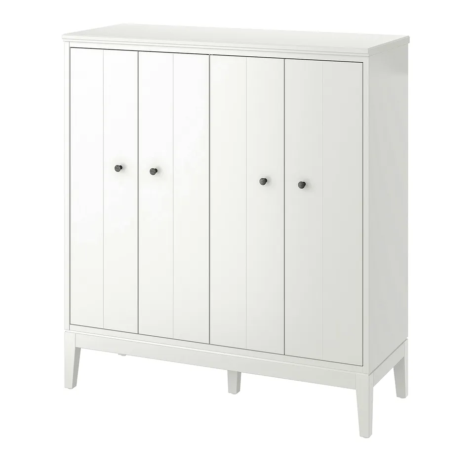 White IDANÄS cabinet with folding doors, timeless design, wall mountable safety fittings.