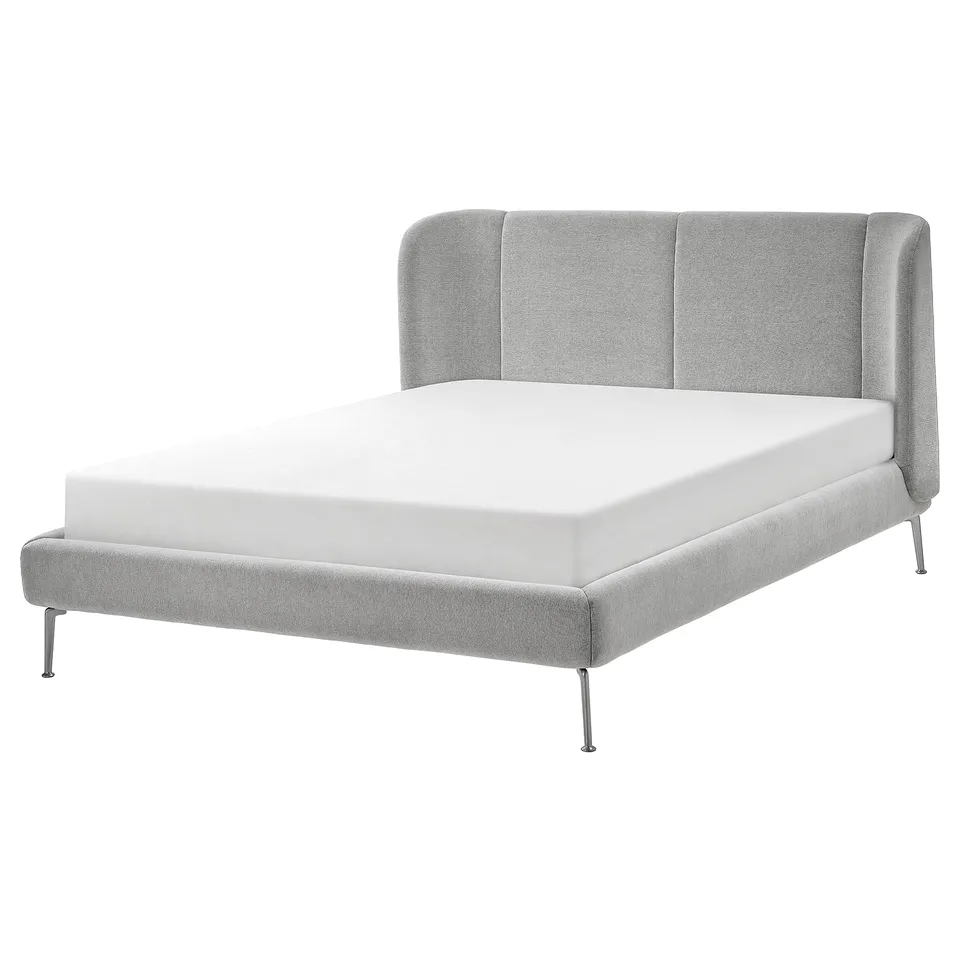 Modern grey TUFJORD bed, curved headboard, upholstered in soft grey fabric, with slim metal legs.