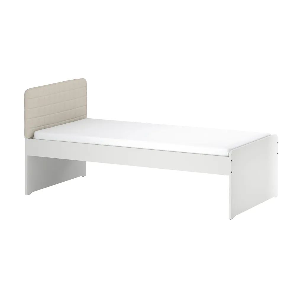 A white SLÄKT single bed with a padded beige headboard. Simple and modern design, suitable for a childs room.