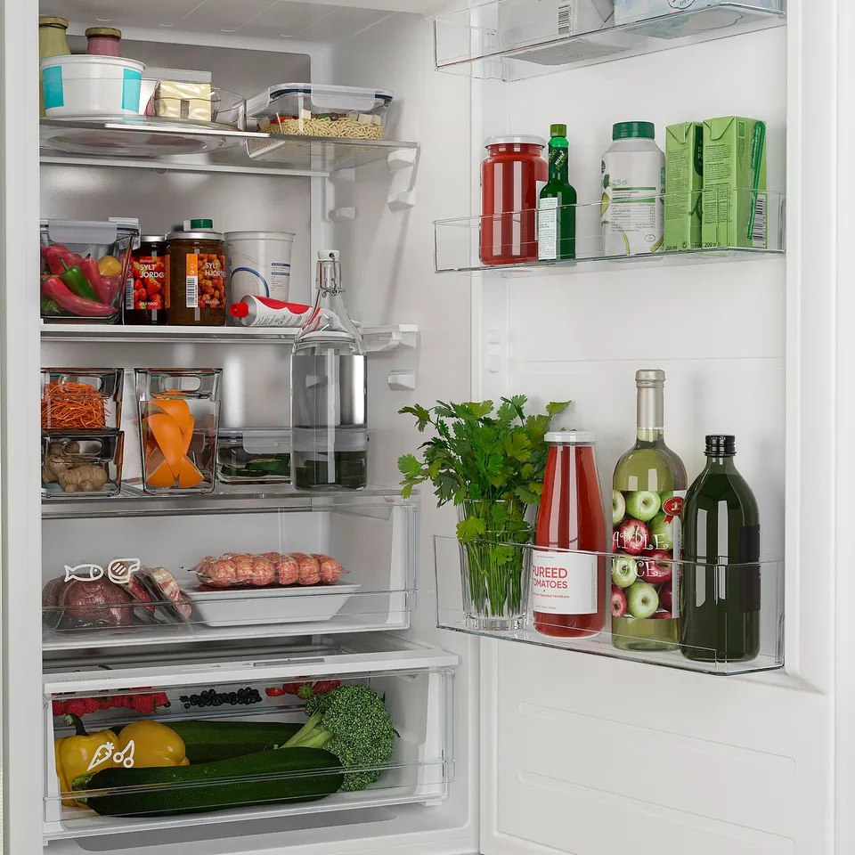 Well-organized refrigerator with adjustable shelves, wider drawers, and led lighting for optimal food storage and visibility.