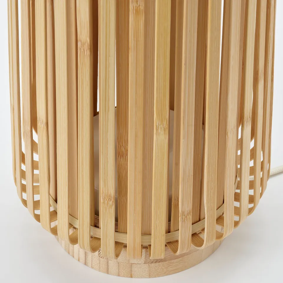 Bamboo lamp with thin, natural slats; high-quality craftsmanship visible.